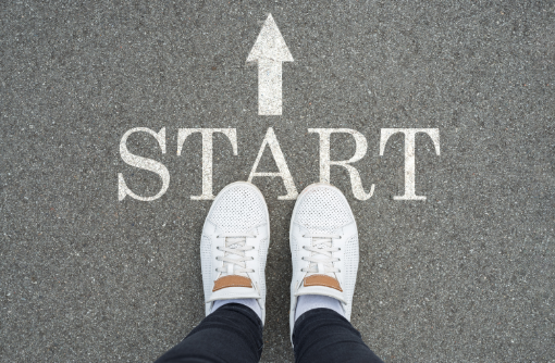 concept-new-2022-legs-white-sneakers-stand-start-asphalt-track-view-from