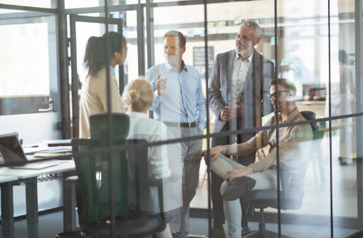 group-multiracial-colleagues-discussing-business-sharing-fresh-ideas-while-having-meeting