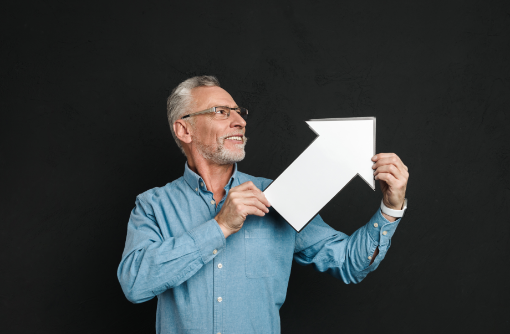 photo-bearded-gentleman-60s-with-grey-hair-wearing-eyeglasses-holding-blank-speech-arrow-pointer-directing-aside-isolated-black-wall